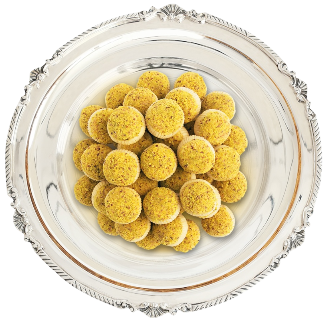 Tunisian almond tajin dessert cut into small squares by Masmoudi Gourmet